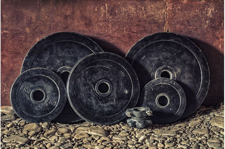 black-bumper-plates-dirty-equipment